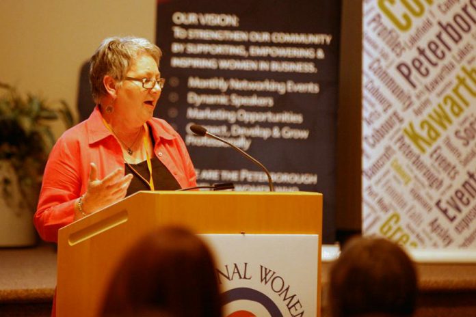 Thirteen Moons Wellness owner Louise Racine speaking at the 2018 International Women's Day Conference in Peterborough. Racine organized the first conference in 2017 using the funds she received as the winner of the 2016 Judy Heffernan Award. A portion of the proceeds from the 2019 conference will support the 2019 Judy Heffernan Award. (Photo:  International Women's Day Conference Peterborough)