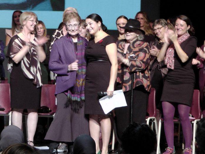 As several of the 54 women who received leadership awards applaud, Sister Ruth Hennessey accepts the Lifetime Achievement Award from Peterborough-Kawartha MP and Minister of Status of Women Maryam Monsef at the inaugural Peterborough-Kawartha Women's Leadership Awards, held on October 27, 2018 at Showplace Performance Centre in downtown Peterborough. (Photo: Bruce Head / kawarthaNOW.com)