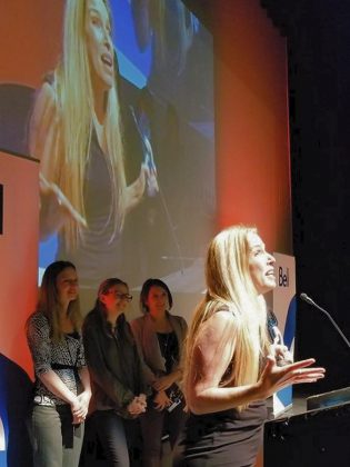 Tina Bromley, owner of Tiny Greens Plant Cafe, accepts the Local Focus award at the Peterborough Business Excellence Awards ceremony at  Showplace Performance Centre in downtown Peterborough on October 17, 2018 as her team looks on. (Photo: Tiny Greens / Twitter)