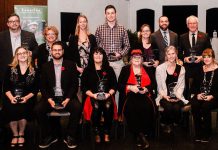 The recepients of the 2018 Awards of Excellence (back to front, left to right): Jason Ross, The Regency of Lakefield; Susan Dunkley, Peterborough Humane Society; Alex Tindale, Peterborough Humane Society; Alex Gastle, Vetterview; Tracy Logan, Logan Tree Experts; Matt Logan, Logan Tree Experts; Ross Bletsoe, Lakefield Foodland; Laurie Siblock, Lang Pioneer Village Museum; Shawn Morey, Peterborough Humane Society; Cindy Windover, Windover Plumbing; Audrey Von Bogen, Shambhala Bed and Breakfast; Emily Wilkins, Adventure Outfitters; Rachel Sloan, Trinkets & Treasures. (Photo: Erin Caitlin Photography)