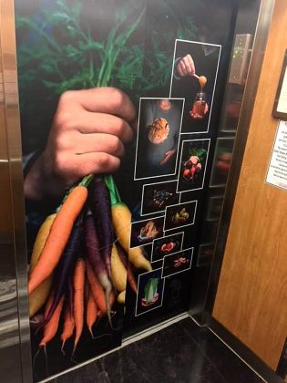 Promotional wrap for the market inside the elevator from the underground parking in Peterborough Square. (Photo: Peterborough Regional Farmers' Market / Facebook)