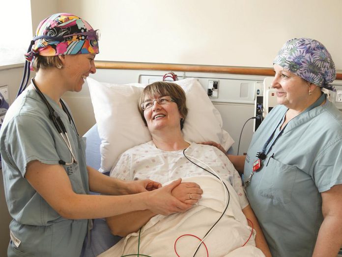 Dr. Katy Shufelt (left), Interventional Cardiologist at Peterborough Regional Health Centre, with a patient in the recovery area of the hospital's Cardiac Catheterization Laboratory. PRHC cardiologists like Dr. Shufelt use electrocardiogram (ECG) test results as the first step to diagnose heart attacks. Private donations from people like you will allow PRHC to replace six of the hospital's ECG machines that are nearing the end of their lifespan. (Supplied photo)