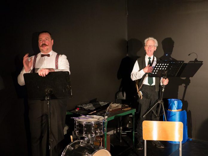 Musicians Matt Greco and Curtis Driedger provide accompaniment with on-stage tech by Eryn Lidster. (Photo: Andy Carroll for Public Energy)