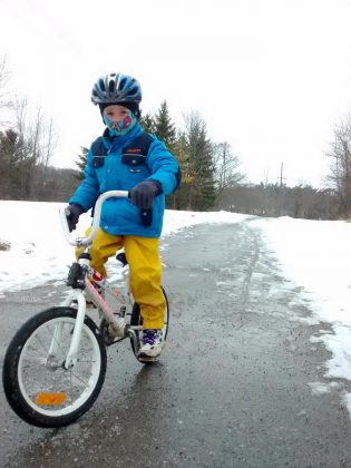 Kids can winter cycle, too! You and your kids will enjoy the journey by slowing down, keeping it fun, and making every snow bank an adventure. (Photo: Jaime Akiyama)