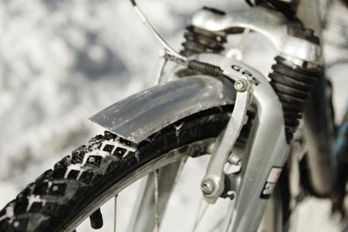 Studded tires will help you ride in the snow and fenders will help protect your clothes and body from the spray off your tires. (Photo: EnviroCentre)