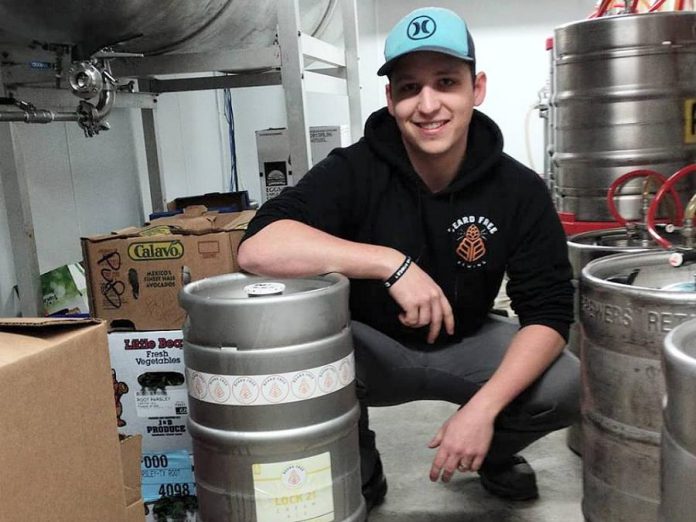 Peterborough microbrewery Beard Free Brewing opened on March 23, 2018. Pictured is head brewer Nyckolas Dubé with a keg of Lock 21 destined for Publican House Brewery. (Photo: Beard Free Brewing)
