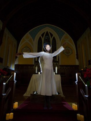 Mosun Fadare as Angela, the mysterious women who arrives in Millbrook on the night of the Christmas pageant. (Photo: Wayne Eardley, Brookside Studio)