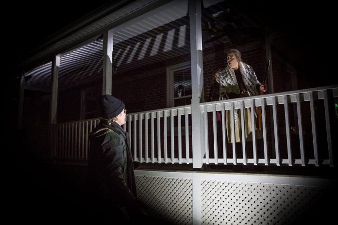 "The Other: A Strange Christmas Tale" takes the audience through the streets and history of Millbrook, from porches to parks. Pictured is Robert Winslow with Emma Khaimovich and Hilary Wear. (Photo: Wayne Eardley, Brookside Studio)