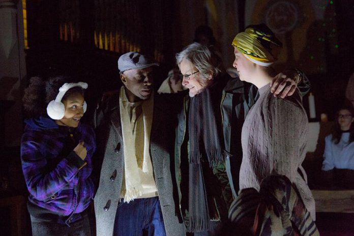 In "The Other: A Strange Christmas Tale", Leanne (Jalen Brink, left) is the daughter of Bill (Danny Waugh, second from left) and Judy (Naomi Duvall, right), who is estranged from her bigoted father Ebbie Krank (Robert Winslow, second from right). When a mysterious woman arrives in the Village of Millbrook, Ebbie is taken on a journey through his past, present, and future to understand the causes of his racism. (Photo: Wayne Eardley, Brookside Studio)