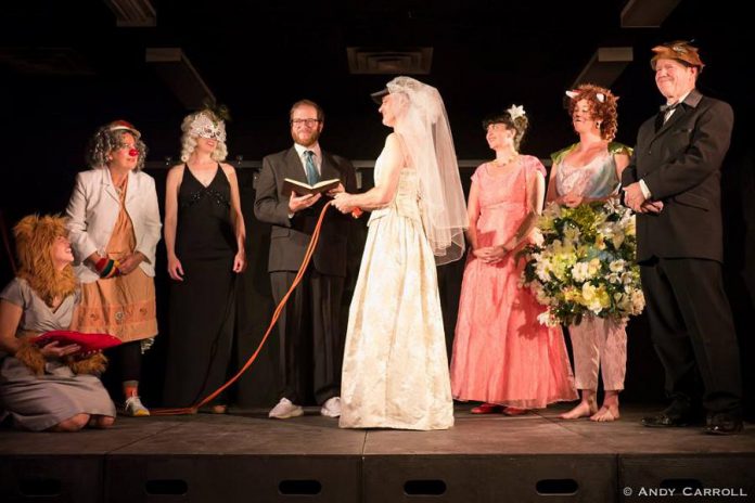 Ryan Kerr (in the wedding dress) demonstrates his commitment to the new The Theatre of King at a ceremony officiated by performer and writer Andrew Root. (Photo: Andy Carroll)