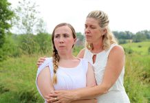 Grace Thompson as 15-year-old Serena with Cynthia Ashperger as her mom Ramona in Judith Thompson's play "Who Killed Snow White?" at the Winslow Farm in Millbrook. The controversial departure from 4th Line Theatre's usual historical fare was one of the best theatrical productions of 2018 according to kawarthaNOW's theatre reviewer Sam Tweedle. (Photo: Heather Doughty / kawarthaNOW.com)