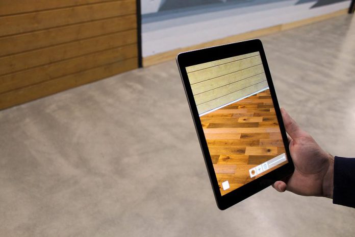 An augmented reality mobile app developed by Kavtek helps customers of Monaghan Lumber in Cavan choose new flooring for their home. (Supplied photo)