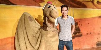 Alice the Camel with Toronto actor Armon Ghaeinizadeh, who plays Ali Baba, at a reherasal of "Ali Baba and the Forty Thieves", Globus Theatre's family panto version of the classic Middle Eastern folk tale. Written by Sarah Quick and also starring Sarah, James Barrett, Siobhan O'Malley, and a rotating cast of 50 children, the play runs from December 7 to 16, 2018 at the Lakeview Arts Barn in Bobcaygeon. (Photo: Sam Tweedle / kawarthaNOW.com)