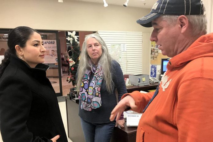 Peterborough-Kawartha MP Maryam Monsef dropped by Carol's Place in Peterborough Square on Tuesday morning (December 18), chatting with volunteers Susan Gontier and Dan Hennessey as well as a few clients of the drop-in centre. (Photo: Paul Rellinger / kawarthaNOW.com)