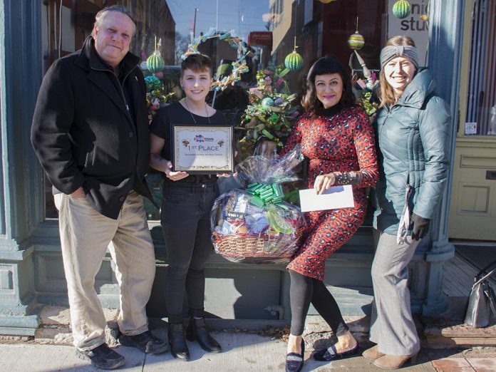 DBIA executive director Terry Guiel with first place winner Union Studio at 391 Water Street.  (Photo courtesy of Peterborough DBIA)