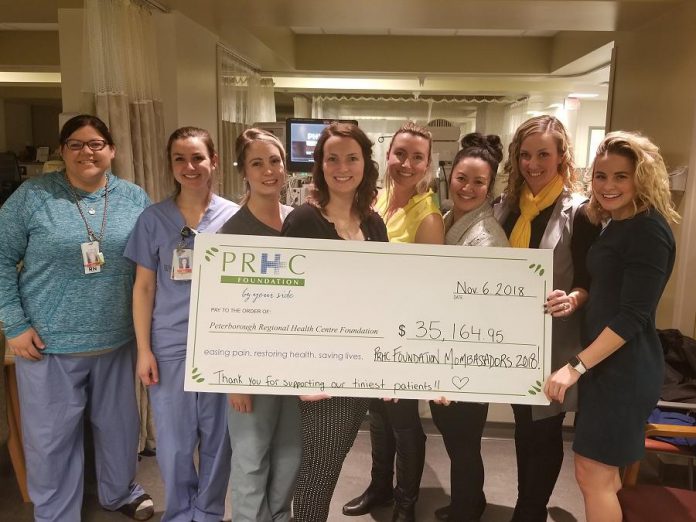Some of the members of the 2018 PRHC Foundation Mombassadors with staff of  the Neonatal Intensive Care Unit at Peterborough Regional Health Centre (PRHC). The cheque for $35,164.95 represents the proceeds raised during the group's fundraiser for the PRHC Foundation to purchase a new  Electronic Fetal Monitor for the Labour & Delivery Unit. (Supplied photo)
