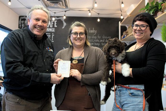 DBIA executive director Terry Guiel and owners Jennifer Avis and Stephanie Hayes of Hello, Baby!, where the winning Holiday Shopping Passport belonging to Avis Moores of Omemee was drawn on January 9, 2019. Moores will receive $1,500 in downtown money that she can redeem at participating businesses in downtown Peterborough. (Photo courtesy of Peterborough DBIA)