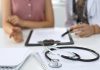 A doctor with a patient. (Stock photo)