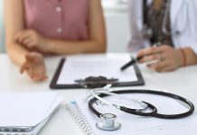 A doctor with a patient. (Stock photo)