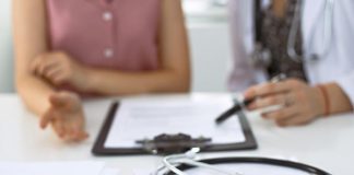 A doctor with a patient. (Stock photo)