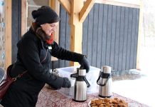 The Danish concept of "hygge" (pronounced "hue-gah") is about embracing the coziness of the winter season, which can include cuddling up with a blanket and a hot drink at home or heading outside to enjoy nature. GreenUP's Lindsay Stroud combines both at GreenUP Ecology Park with some treats of warm cider and homemade cookies. (Photo: Karen Halley)