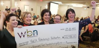 Danielle McIver (left) and Lori McKee (right) of the Women's Business Network of Peterborough celebrate the organization's donation of $22,486.15 to YWCA Peterborough Haliburton with Donna Masters (second from left) and Ria Nicholson (second from right) at the Holiday Inn in downtown Peterborough on January 9, 2019. (Photo: Jeannine Taylor / kawarthaNOW.com)