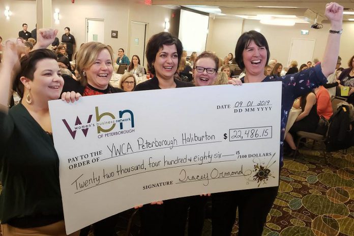 Danielle McIver (left) and Lori McKee (right) of the Women's Business Network of Peterborough celebrate the organization's donation of $22,486.15 to YWCA Peterborough Haliburton with Donna Masters (second from left) and Ria Nicholson (second from right) at the Holiday Inn in downtown Peterborough on January 9, 2019. (Photo: Jeannine Taylor / kawarthaNOW.com)