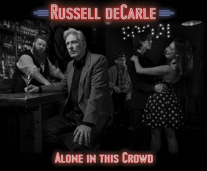  Russell deCarle's latest solo effort is "Alone In This Crowd".