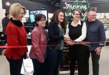Peterborough mayor Diane Therrien (middle) cuts the ribbon for the official opening of the renovated Jo Anne's Place health food store at 1260 Lansdowne Street West in Peterborough. Also pictured (left to right) are city councillors Kim Zippel and Lesley Parnell and Jo Anne's Place owners Margo and Paul Hudson. (Photo: Jeannine Taylor / kawarthaNOW.com)