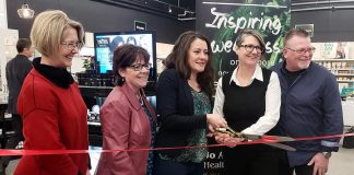 Peterborough mayor Diane Therrien (middle) cuts the ribbon for the official opening of the renovated Jo Anne's Place health food store at 1260 Lansdowne Street West in Peterborough. Also pictured (left to right) are city councillors Kim Zippel and Lesley Parnell and Jo Anne's Place owners Margo and Paul Hudson. (Photo: Jeannine Taylor / kawarthaNOW.com)