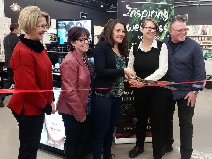 Peterborough mayor Diane Therrien (middle) cuts the ribbon for the official opening of the renovated Jo Anne's Place health food store at 1260 Lansdowne Street West in Peterborough. Also pictured (left to right) are city councillors Kim Zippel and Lesley Parnell and Jo Anne's Place owners Margo and Paul Hudson. (Photo: Jeannine Taylor / kawarthaNOW.com)