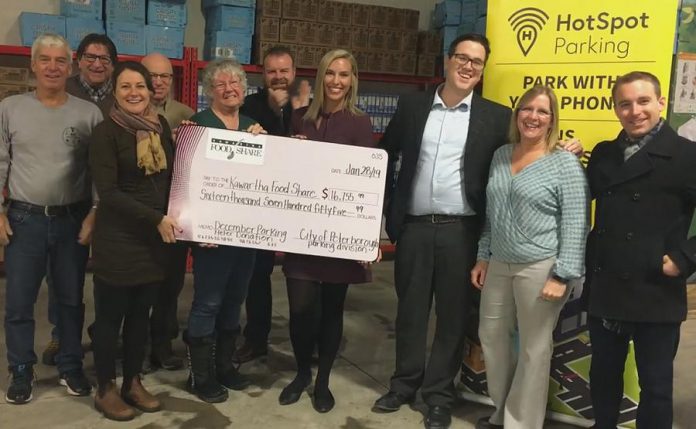 City of Peterborough Mayor Diane Therrien (third from left) presents a cheque for $16,755.99 to Kawartha Food Share. The donation includes $16,256 in parking fees raised during the December two-hour free parking campaign in downtown Peterborough, along with a $500 donation from the campaign's sponsor, HotSpot Parking. (Photo; City of Peterborough)