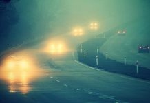 Cars on highway in fog