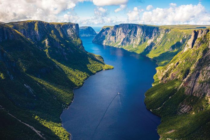 Dubbed the "Jewel of Newfoundland," Gros Morne is located on the west coast of Newfoundland and is a UNESCO World Heritage Site. The area is known for its stunning views, particularly from Western Brook Pond, where a three-kilometre trail leads to an inland fiord with cliffs that ascent 600 metres from the water. (Photo courtesy of Barrett & Mackay Photography)