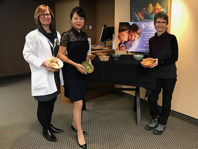 Jane White (registered nurse with Kawartha Cardiology Clinic), Dr. Anna Jo (owner of Cornerstone Family Dentistry), and Joëlle Favreau (Manager of the Nourish project with YWCA Peterborough Haliburton) at the announcement of the 2019  Empty Bowls fundraiser taking place on Friday, March 1.  Kawartha Cardiology Clinic is the title sponsor and Cornerstone Family Dentistry is the to-go sponsor of this year's event. (Photo courtesy of YWCA Peterborough Haliburton)