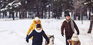 A family going for a winter walk outdoors