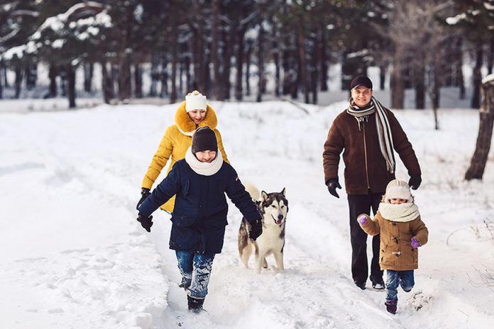 A family going for a winter walk outdoors