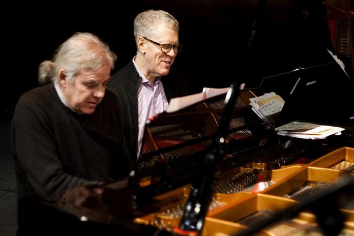 Russell deCarle will also be joined by pianist John Sheard, pictured here with the late Stuart McLean. Sheard was the music director and pianist for McLean's long-running CBC radio show The Vinyl Cafe. (Photo courtesy of John Sheard)