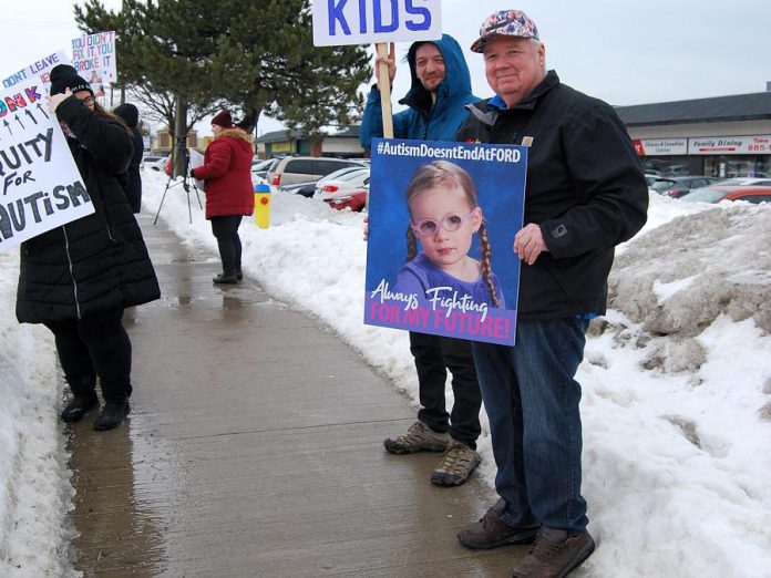 Jack Ferguson holds up a photograph of his granddaughter Lauren, who was diagnosed with autism at the age of two. He says he is going to do whatever it takes to see his granddaughter thrive, including dipping into his retirement savings. (Photo: April Potter / kawarthaNOW.com)
