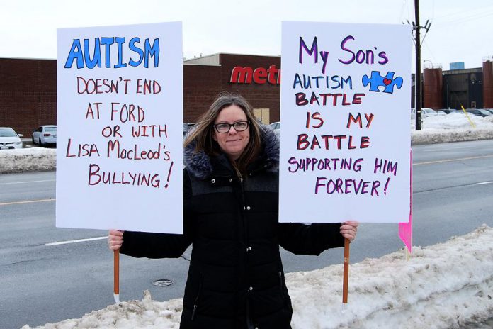 Marjory Leveille is raising her autistic nine-year-old son on her own. She was one of around 25 protesters who gathered outside of Northumberland—Peterborough South MPP David Piccini's constituency office at 117 Peter Street in Port Hope on February 15, 2019 to raise awareness of the impact of the Ontario goverment's changes to the Ontario Autism Program announced on February 6th. (Photo: April Potter / kawarthaNOW.com)