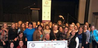 rock Mission executive director Bill McNabb (centre) celebrates the collective donation of more than $10,200 from members of the 100 Women Peterborough group at The Venue in downtown Peterborough on March 19, 2019. Brock Mission is the fifth local organization to receive a donation of at least $10,000 from group since its formation in early 2018. (Photo: Rosalea Terry)