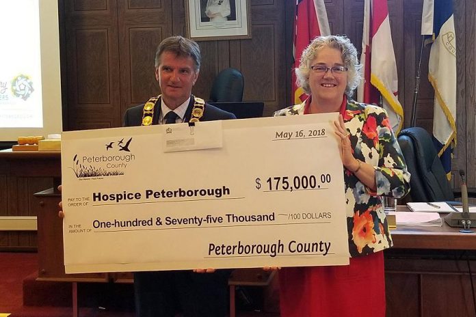 Hospice Peterborough executive director Linda Sunderland (right) accepting a cheque from Peterborough County Warden Joe Taylor in May 2018 for Hospice Peterborough's Every Moment Matters Campaign and the new Hospice Peterborough Care Centre. Sunderland is retiring from the organization after 26 years. (Photo: Hospice Peterborough)