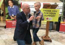 Peterborough Chamber of Commerce President and CEO Stu Harrison, who has been involved with the Easter Seals Telethon for 36 years, interviews the 2019 Ambassador Ryerson Beardmore on Wednesday (March 7th) at the Lansdowne Place kickoff announcement for the annual fundraiser, which takes place on Sunday, April 7th. Born with cerebral palsy, the 8-year0 old James Strath Public School student is now walking without the aid of assistive devices. (Photo: Paul Rellinger / kawarthaNOW.com)