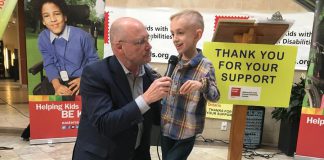 Peterborough Chamber of Commerce President and CEO Stu Harrison, who has been involved with the Easter Seals Telethon for 36 years, interviews the 2019 Ambassador Ryerson Beardmore on Wednesday (March 7th) at the Lansdowne Place kickoff announcement for the annual fundraiser, which takes place on Sunday, April 7th. Born with cerebral palsy, the 8-year0 old James Strath Public School student is now walking without the aid of assistive devices. (Photo: Paul Rellinger / kawarthaNOW.com)