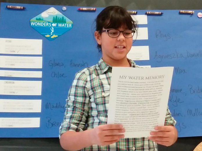 As part of the GreenUP Wonders of Water program, Agnieszka, a grade five student at Monsignor O'Donoghue in Peterborough presents her favourite water memory with her class and shares why she's grateful for water.  (Photo: Karen O'Krafka)