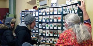 A vendor at last year's Seedy Sunday Peterborough help attendees select from a variety of organic vegetable and herb seeds. The 2019 event takes place on Sunday, March 10th from noon to 5 p.m. at Emmanuel East United Church. (Photo: Jillian Bishop)