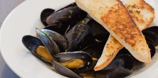 The recently renovated Riverside Grill Restaurant at Holiday Inn Peterborough-Waterfront in downtown Peterborough features a fresh new locally inspired menu that includes starters such as mussels steamed in Publican House beer. To celebrate the new menu, kawarthaNOW readers are eligible for a special deal for half-prized appetizers. (Photo: Miranda Studios)