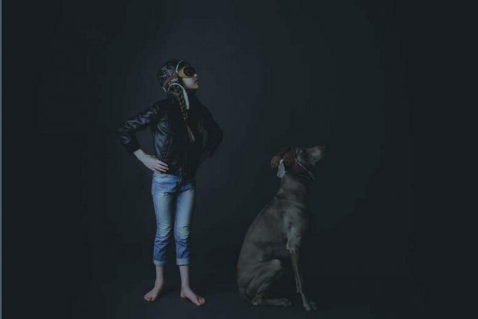 This photo of Bronson and Cole, a girl and her dog, is an ongoing collaborative effort between local photographers Katie Ellement and Heather Doughty. The photo forms the back cover of the 2019 SPARK Photo Festival catalogue. Doughty and Ellement's work will be on display at the Art School of Peterborough, with a reception from 7 to 9 p.m. on Friday, April 12th. (Photo courtesy of SPARK)