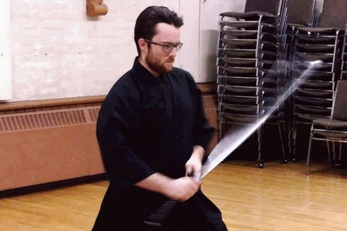 Warren Wagler practising the traditional Japanese martial art of iaido (drawing and cutting with a samurai sword). The Oshawa native, who is a member of  Kenshokan Dojo with locations in Peterborough, Oshawa, Tweed, and Lindsay, won gold in the  sandan (third dan) division at the 2019 East Coast Iaido Taikai (competition) held in Jersey City, New Jersey on February 17, 2019. (Photo courtesy of Team Canada Iaido)