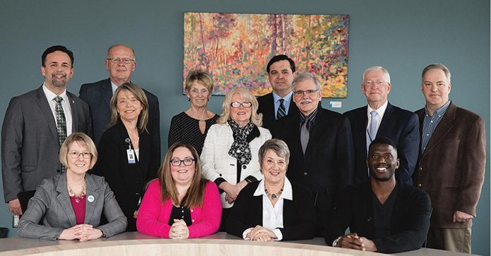 The 2019 board of health for Peterborough Public Health. Back row, left to right: City of Peterborough Councillor Don Vassiliadis, City of Peterborough Councillor Henry Clarke, Medical Officer of Health Dr. Rosana Salvaterra, provincial appointee Catherine Praamsma, Township of Otonabee-South Monaghan Deputy Mayor Bonnie Clark, Township of Cavan Monaghan Deputy Mayor Matthew Graham, Township of Selwyn Mayor Andy Mitchell, provincial appointee Gregory Connolley,  provincial appointee Andy Sharpe. Front row, left to right: City of Peterborough Councillor Kim Zippel, Hiawatha First Nation  Councillor and board chair Kathryn Wilson, provincial appointee and vice-chair Kerri Davies, provincial appointee Michael Williams. (Photo: Peterborough Public Health)